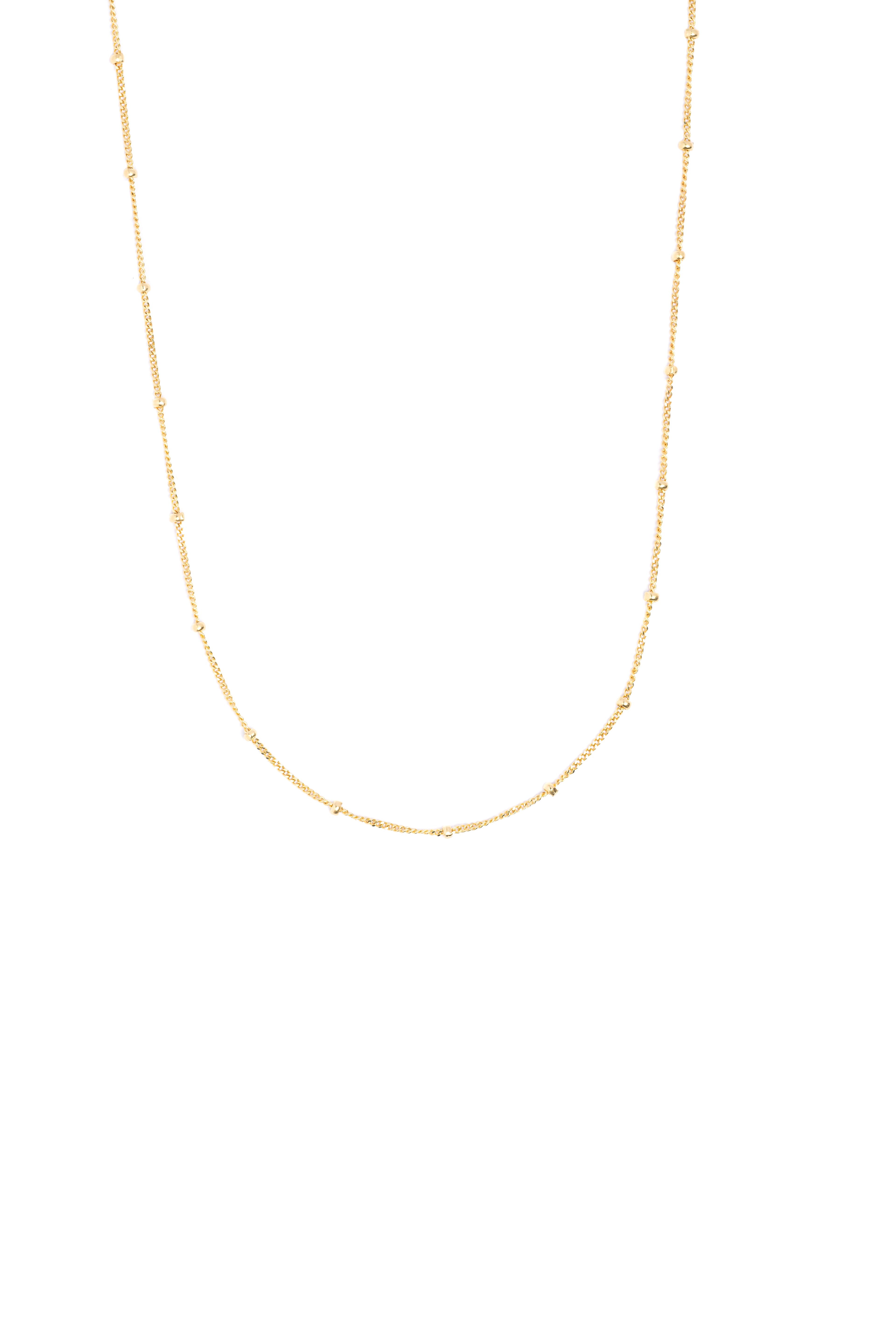 Gold chain necklace on a white background