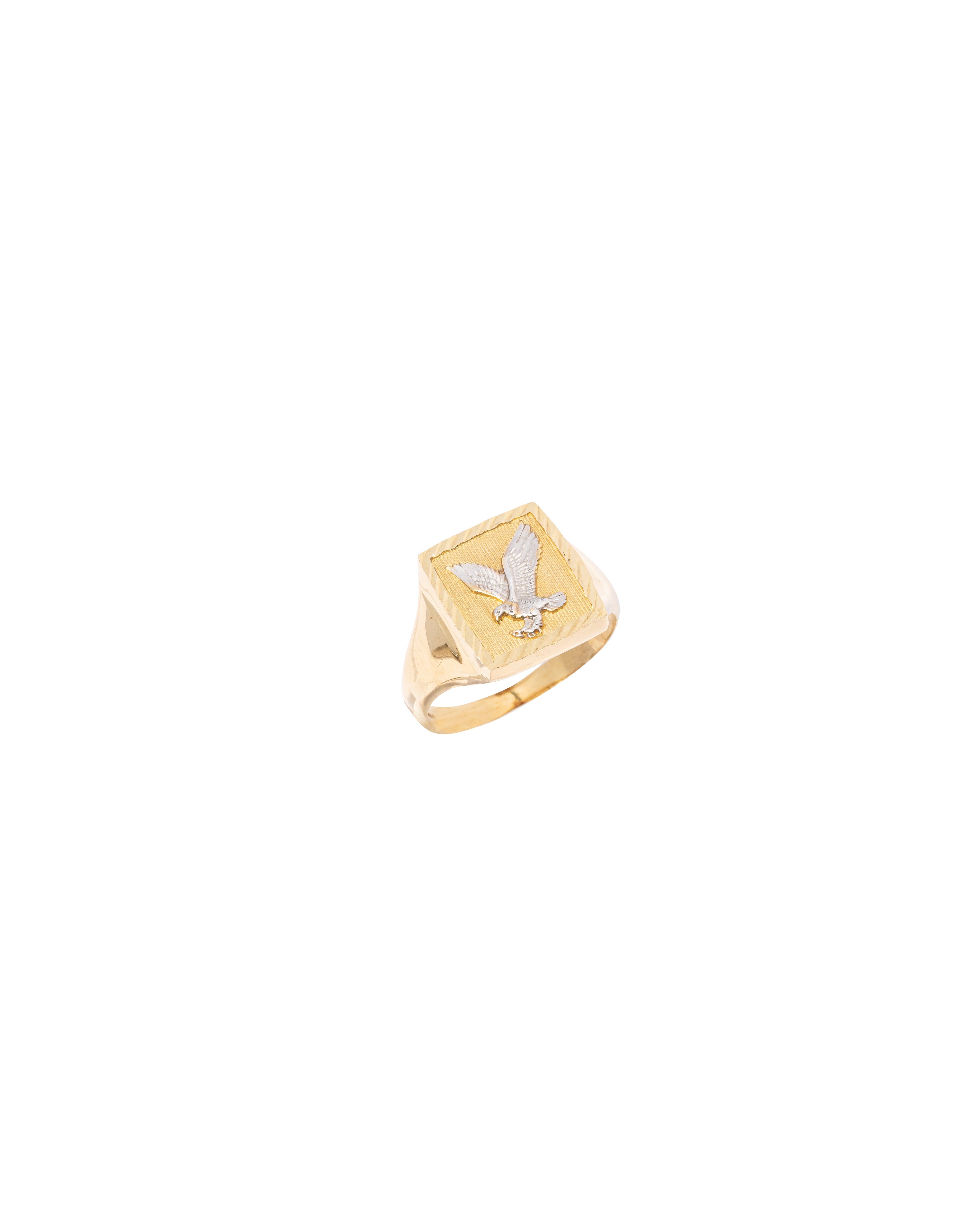 Gold ring with a bird design on a white background