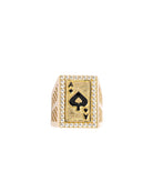 Gold ring with ace of spades design on a white background