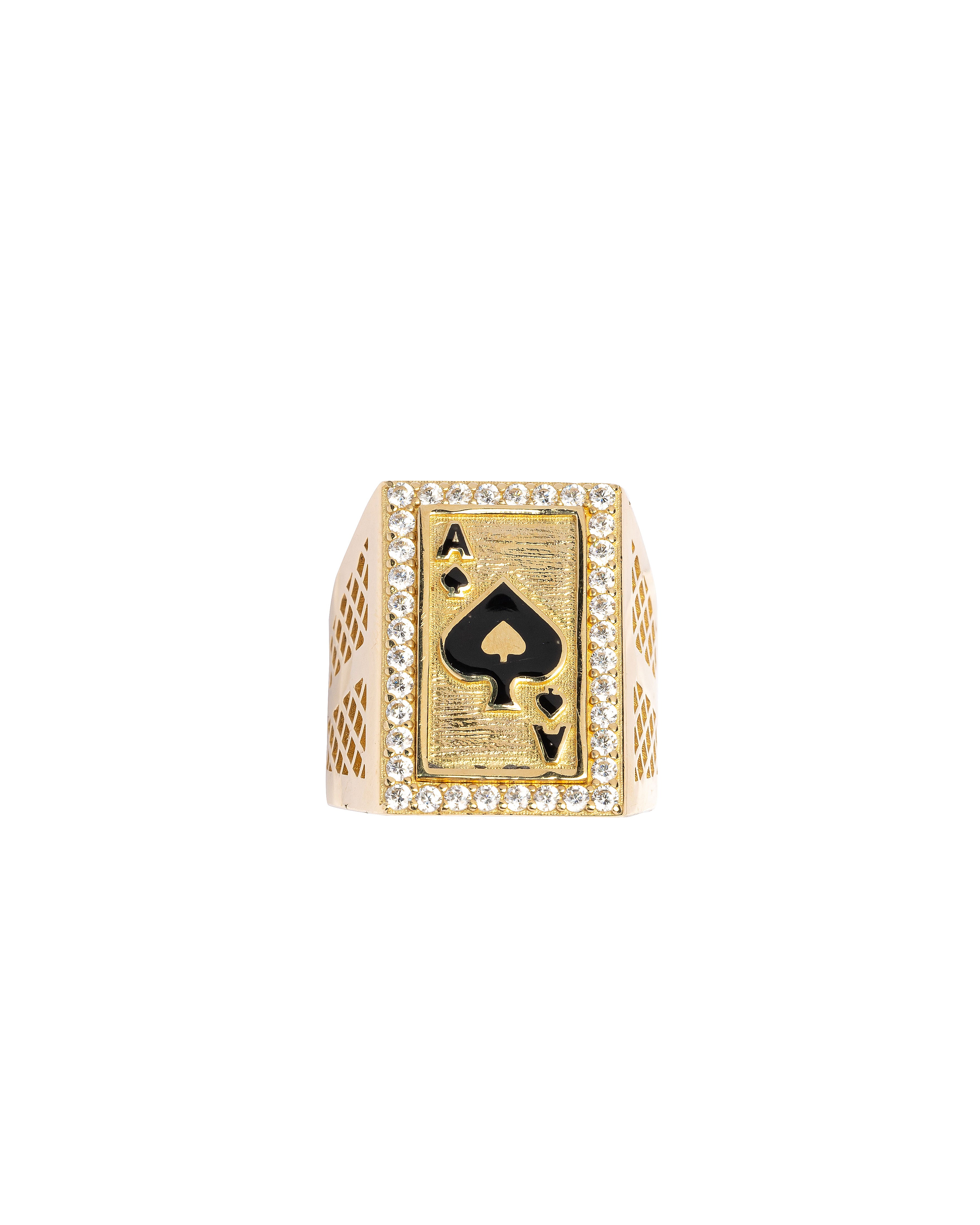 Gold ring with ace of spades design on a white background