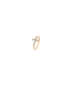 Gold ring with a cross design on a white background