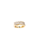 Gold ring with gemstones on a white background