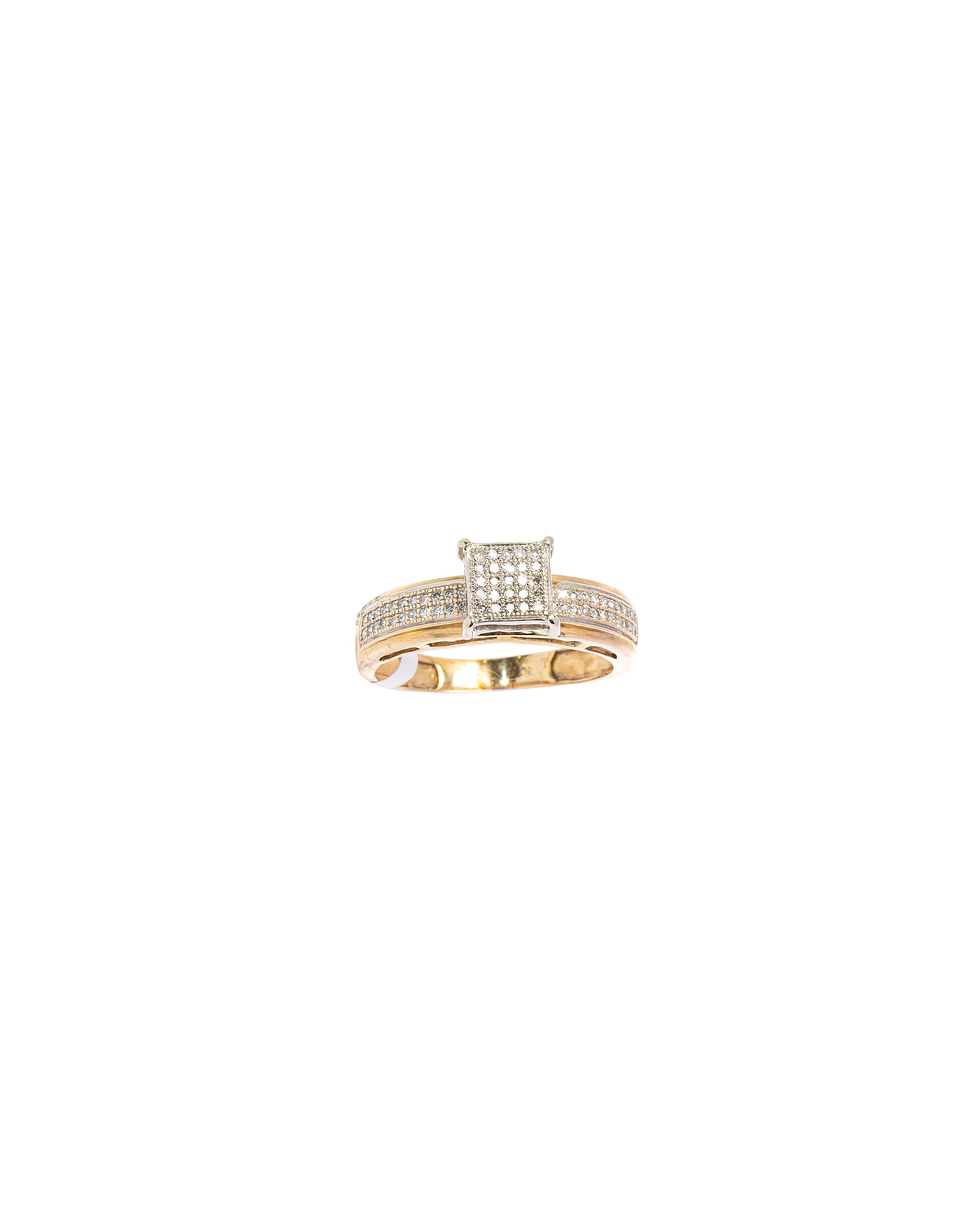 Gold ring with embedded stones on a white background