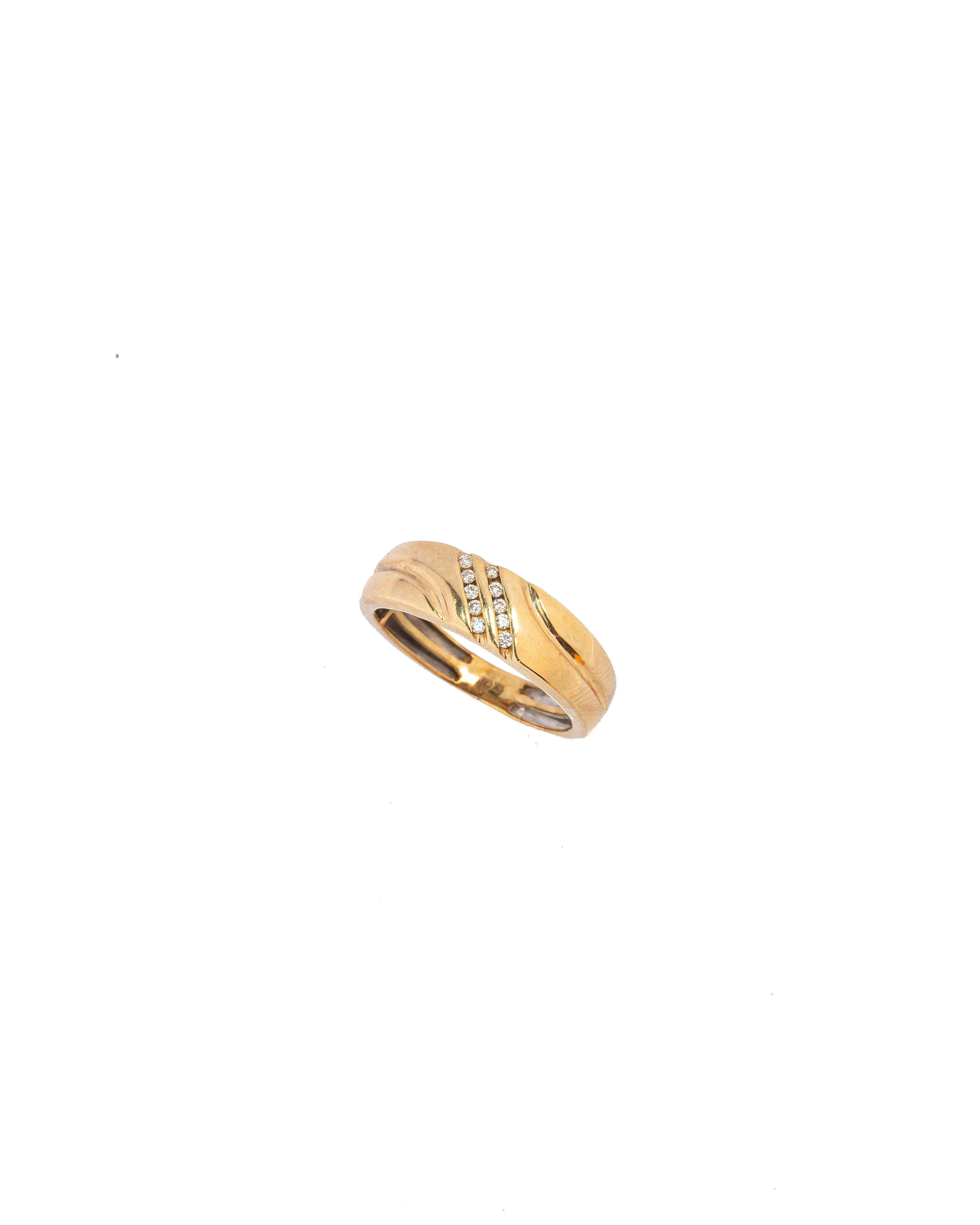 Gold ring with diamonds on a white background