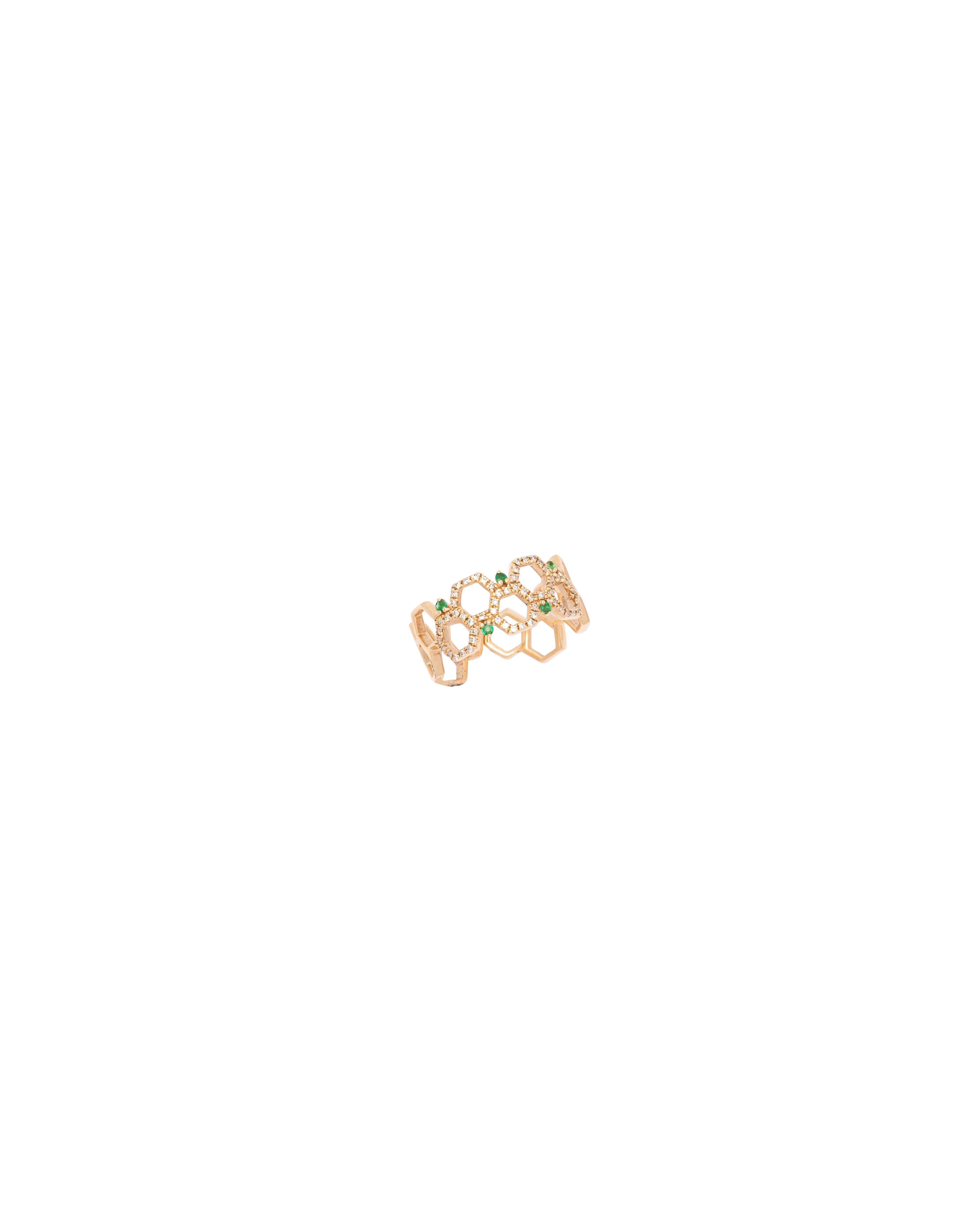 Gold ring with green gemstones on a white background