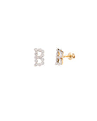 Gold and silver letter 'B' earrings on a white background