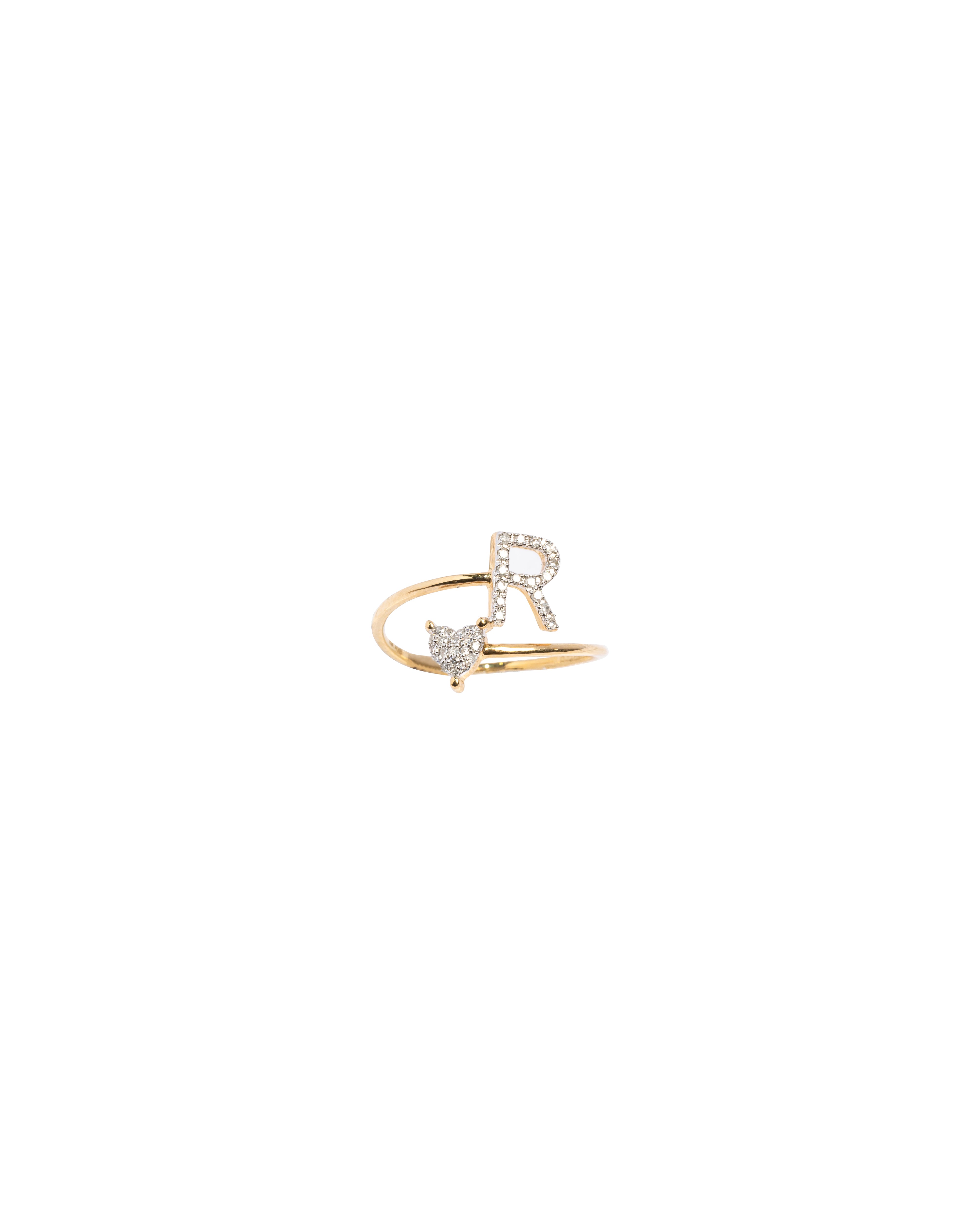 Gold ring with butterfly design on a white background