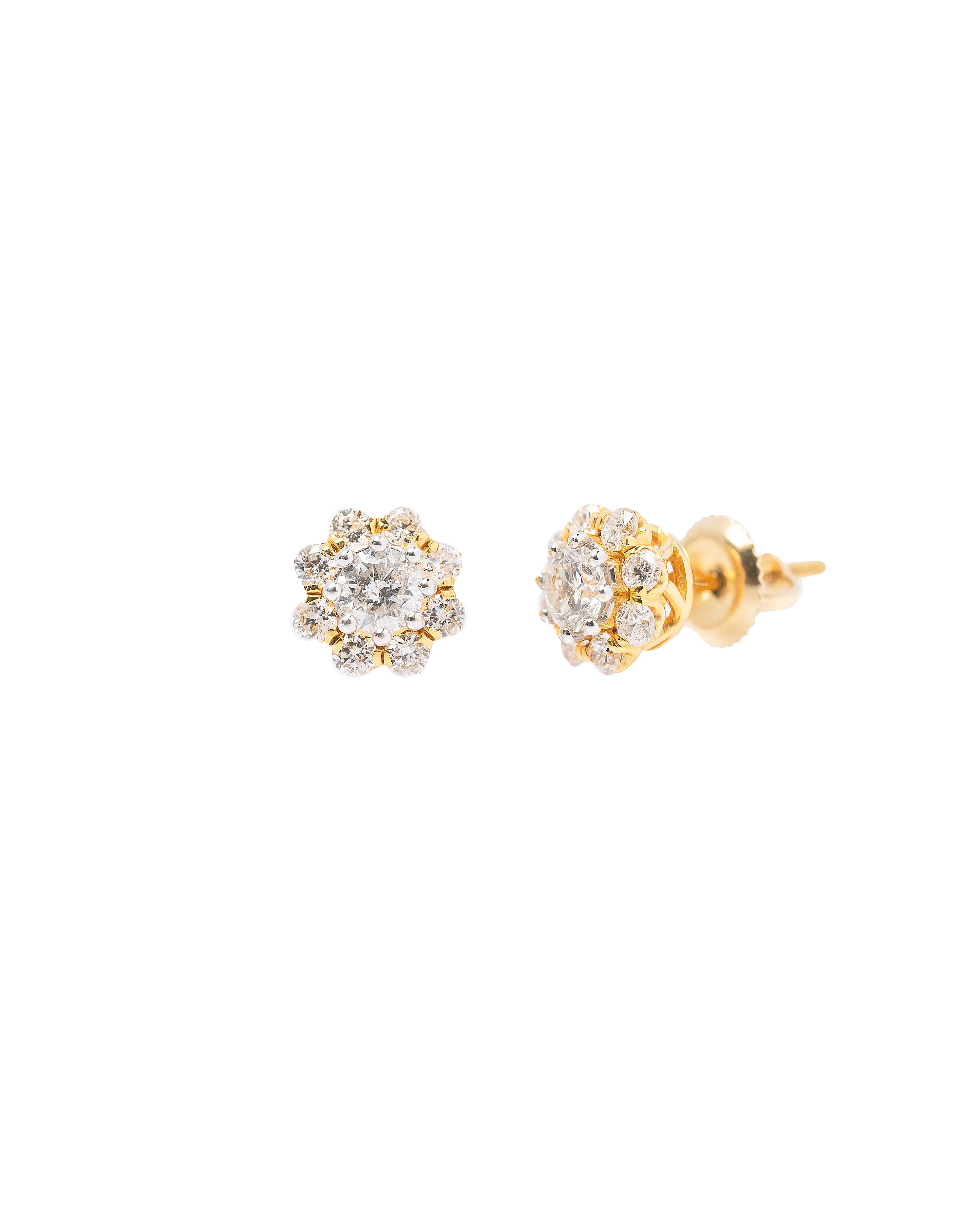 Pair of gold earrings with diamond-like stones on a white background