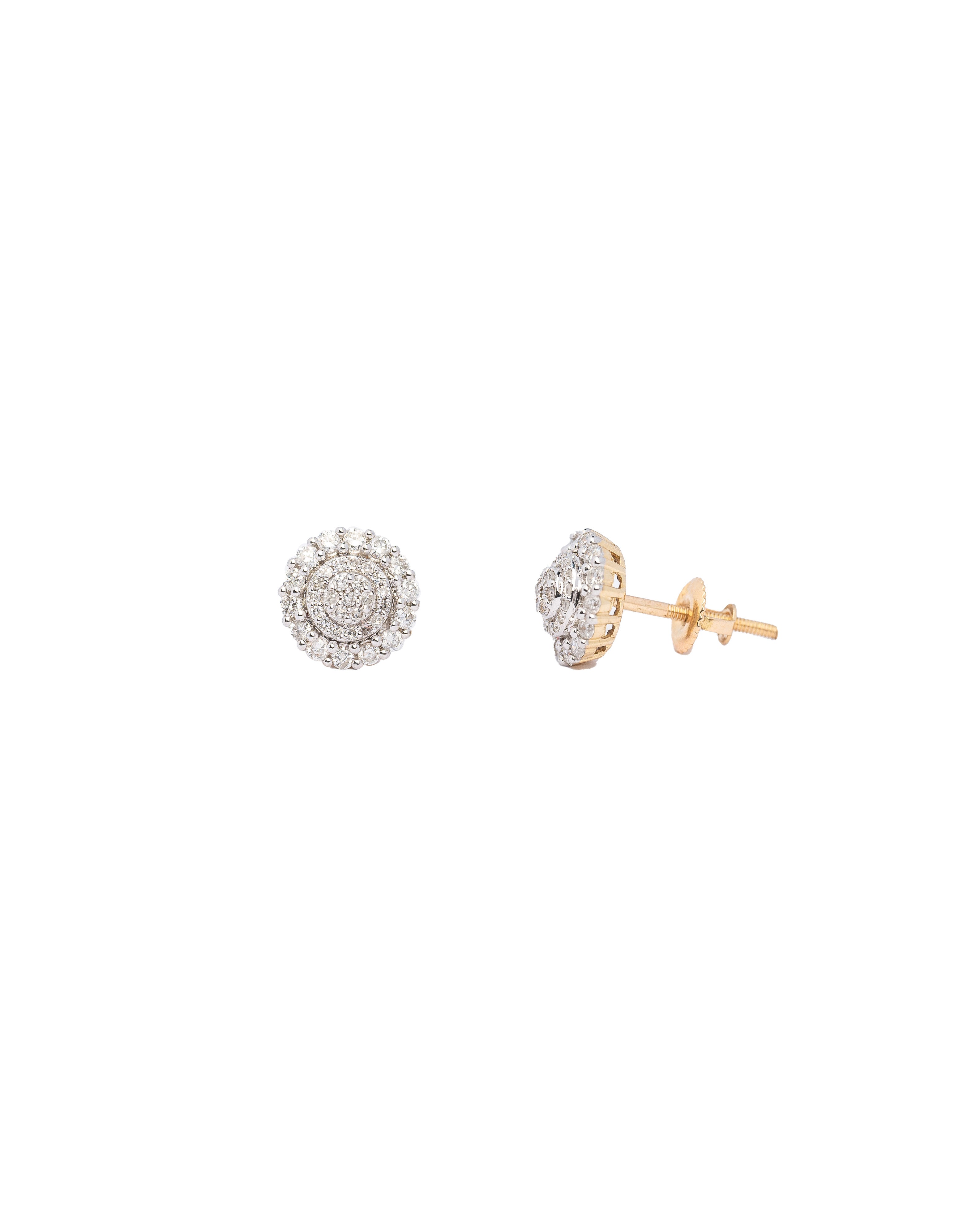 Pair of gold and silver earrings on a white background