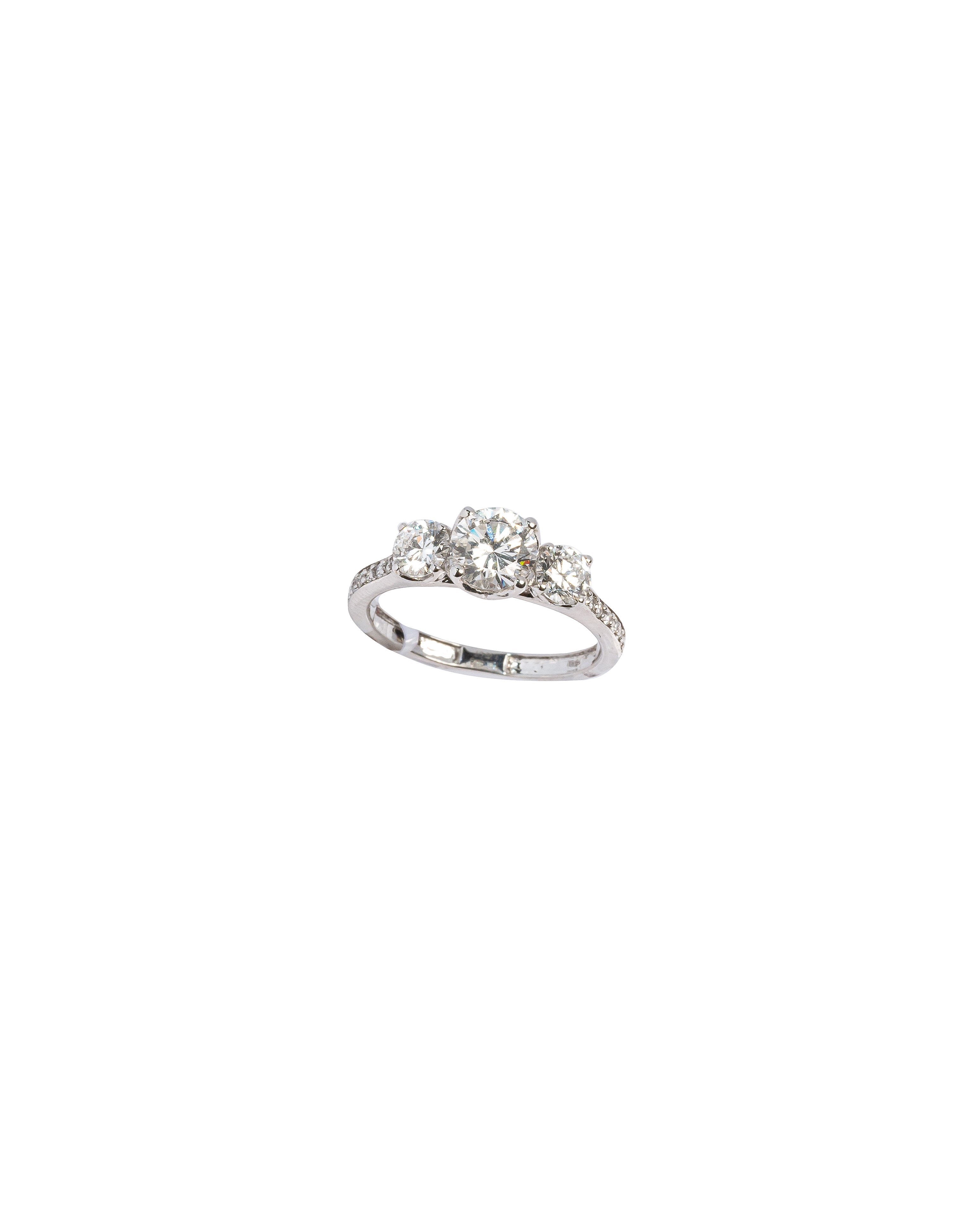 Silver ring with a diamond on a white background