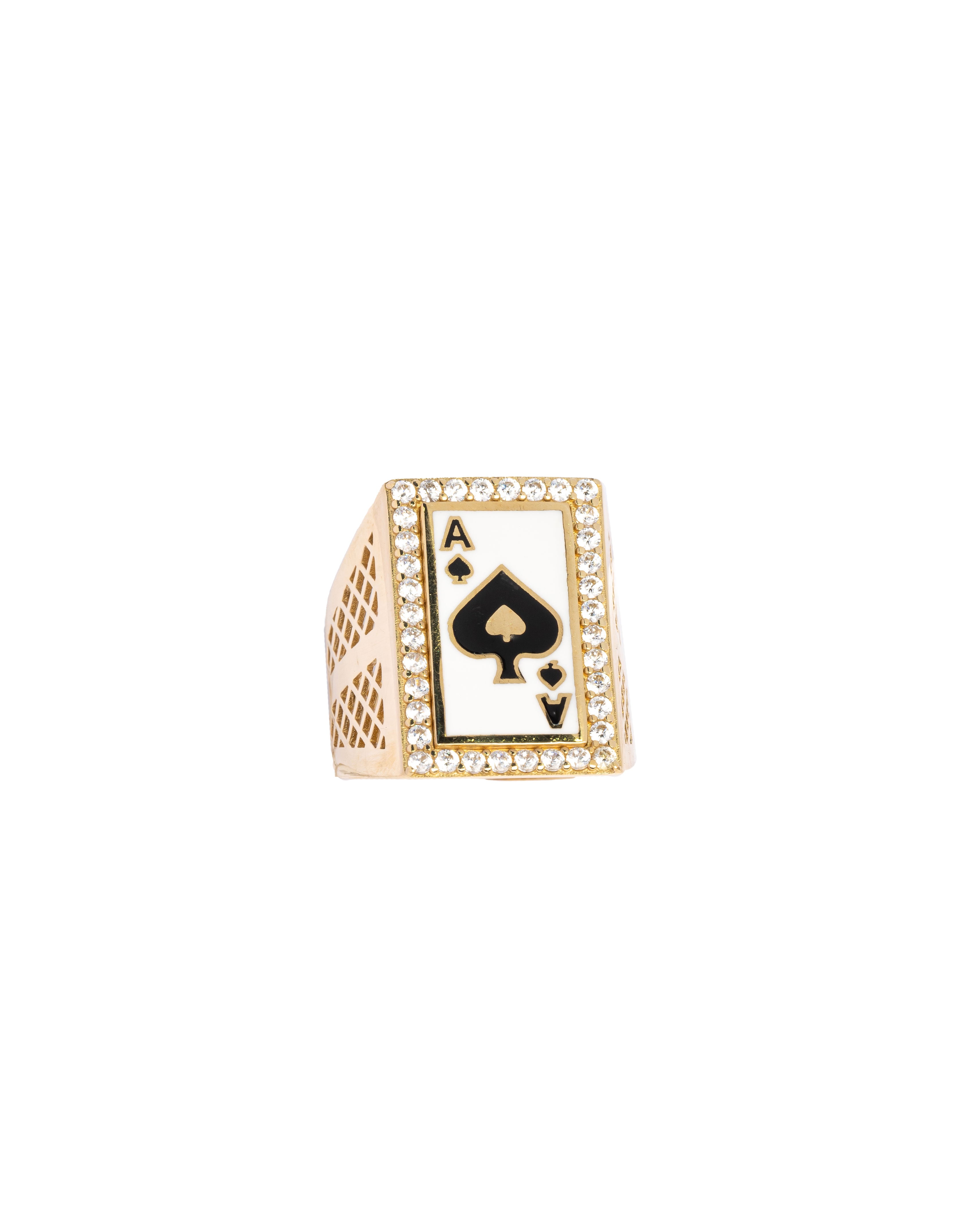 Gold ring with a black spade design on a white background