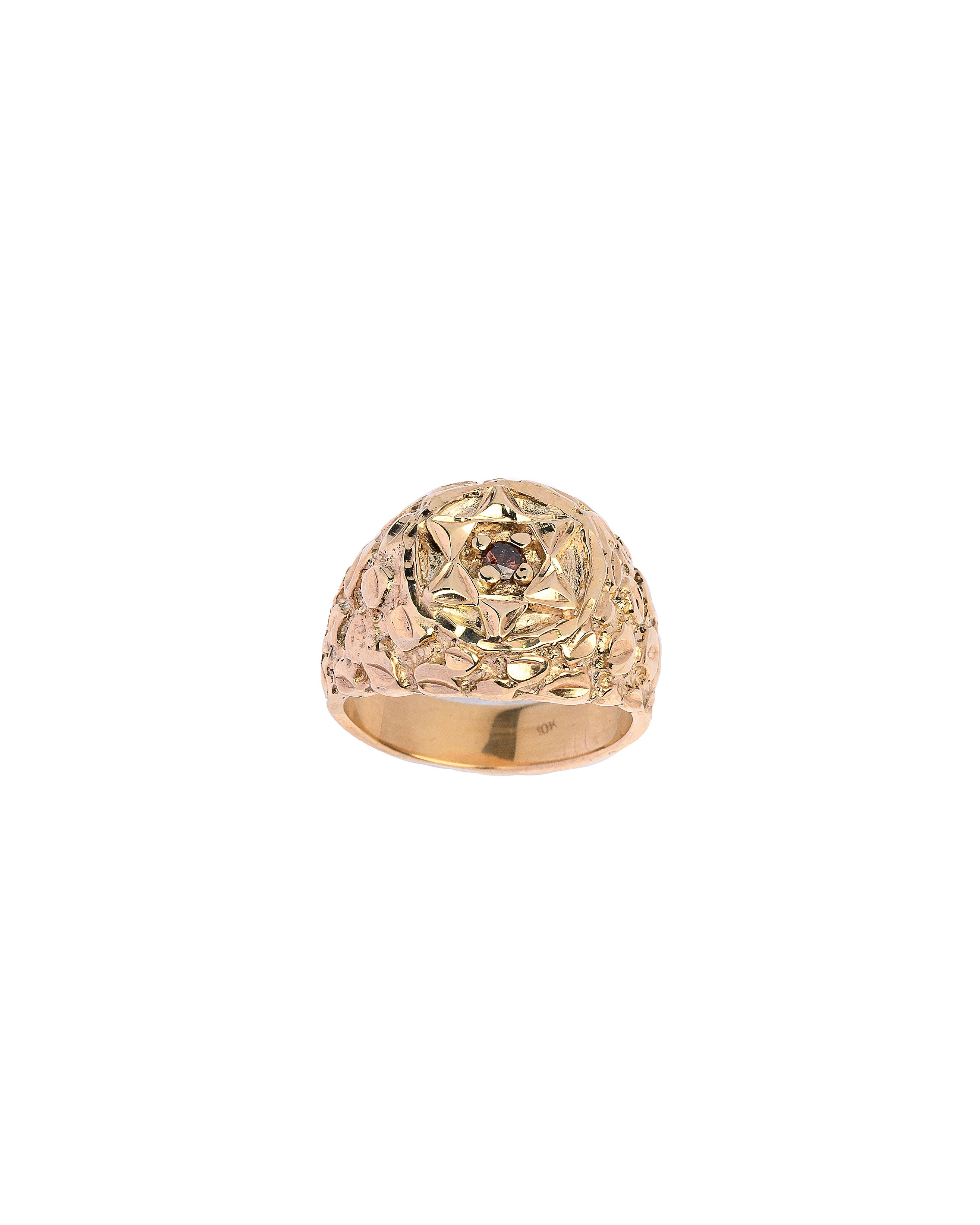 Gold ring with intricate design on a white background