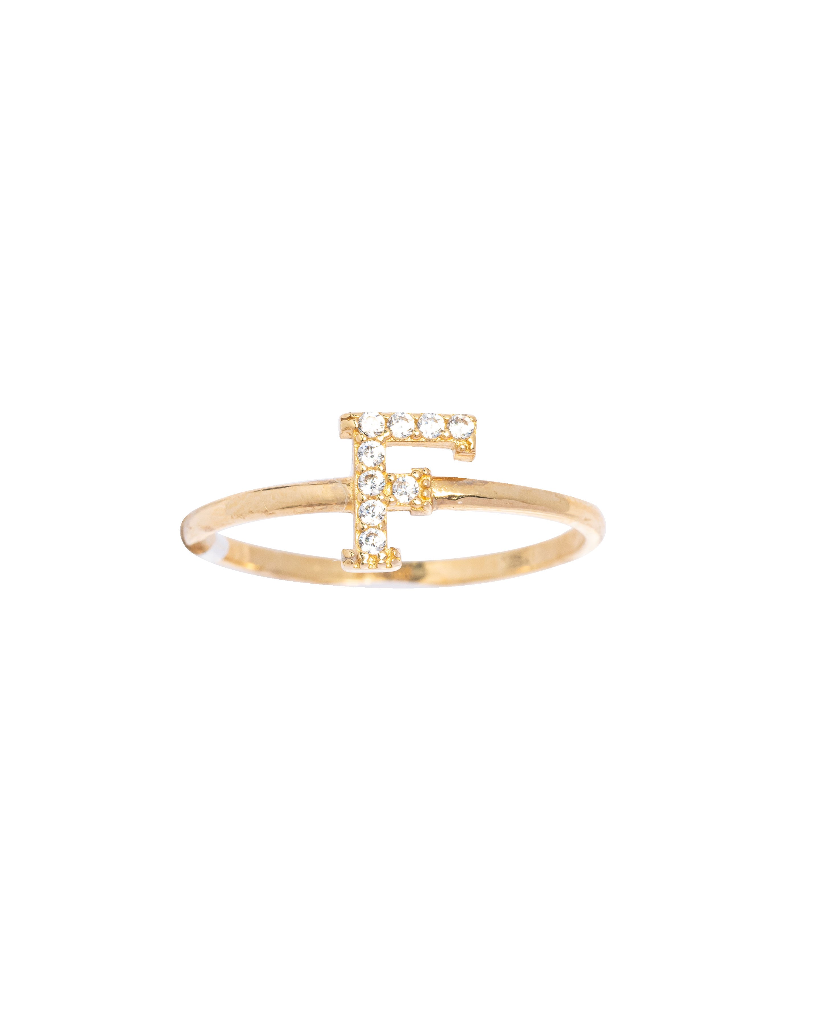 Gold ring with a letter 'H' design on a white background