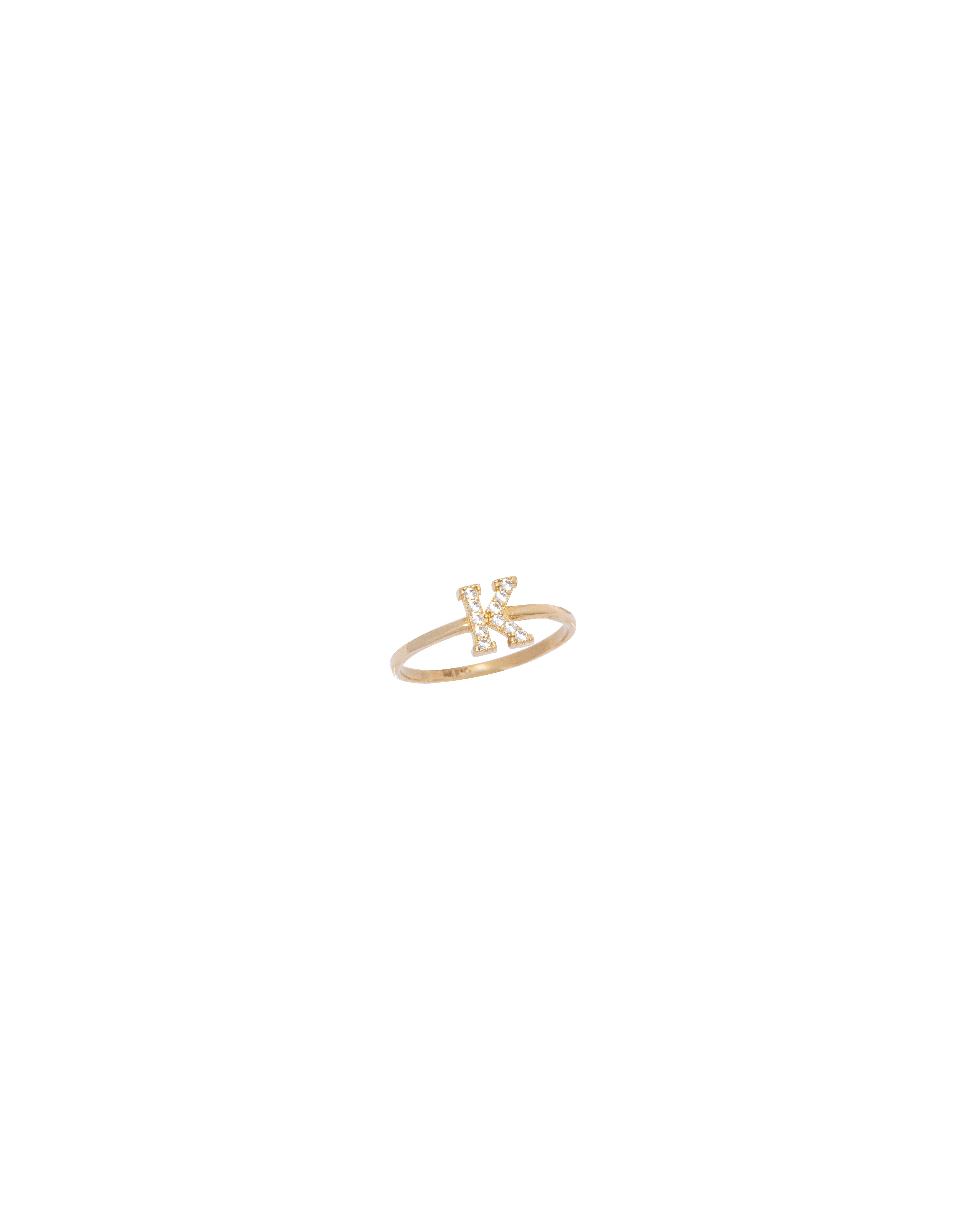 Gold ring with small stones on a white background