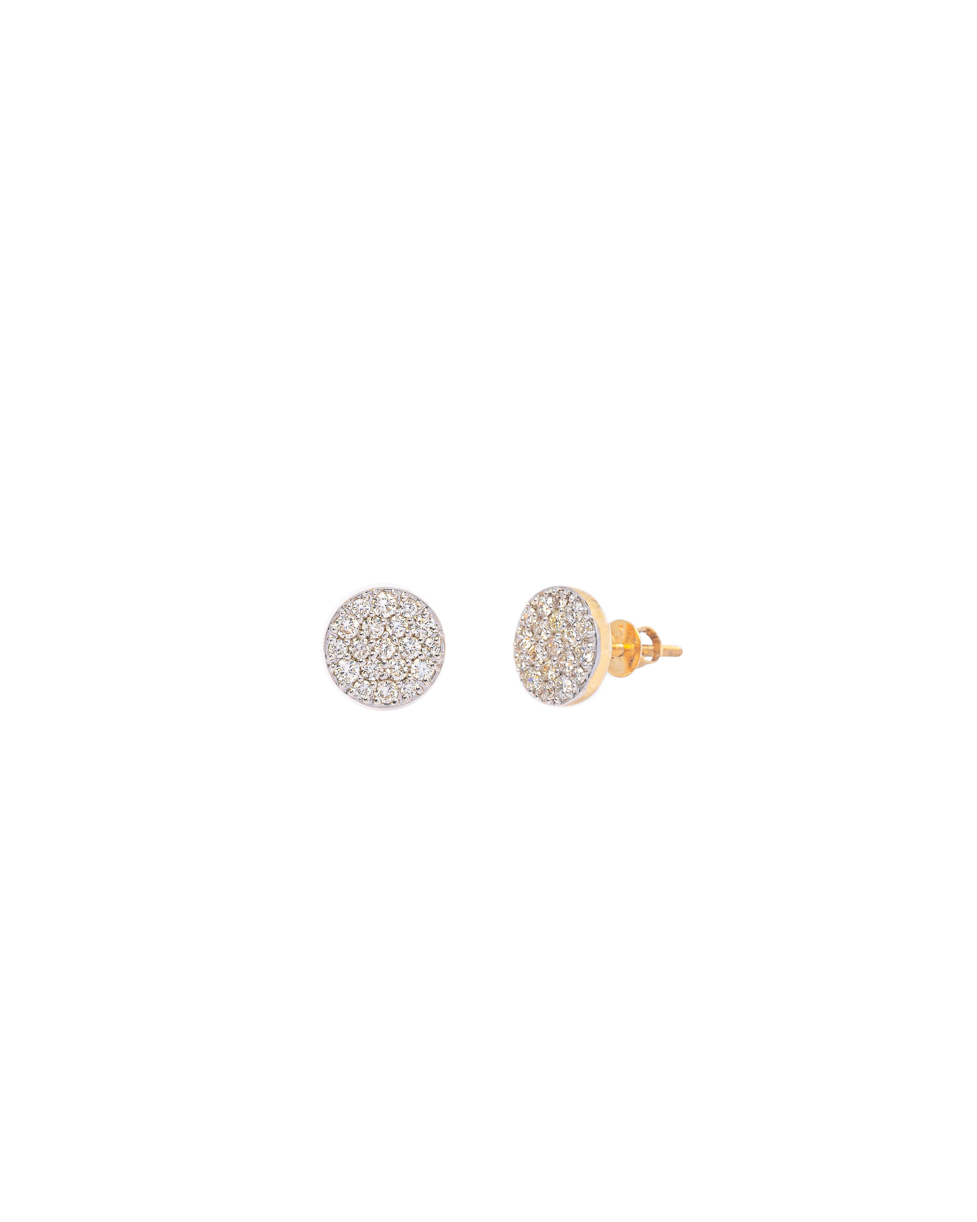 Pair of gold and silver stud earrings on a white background