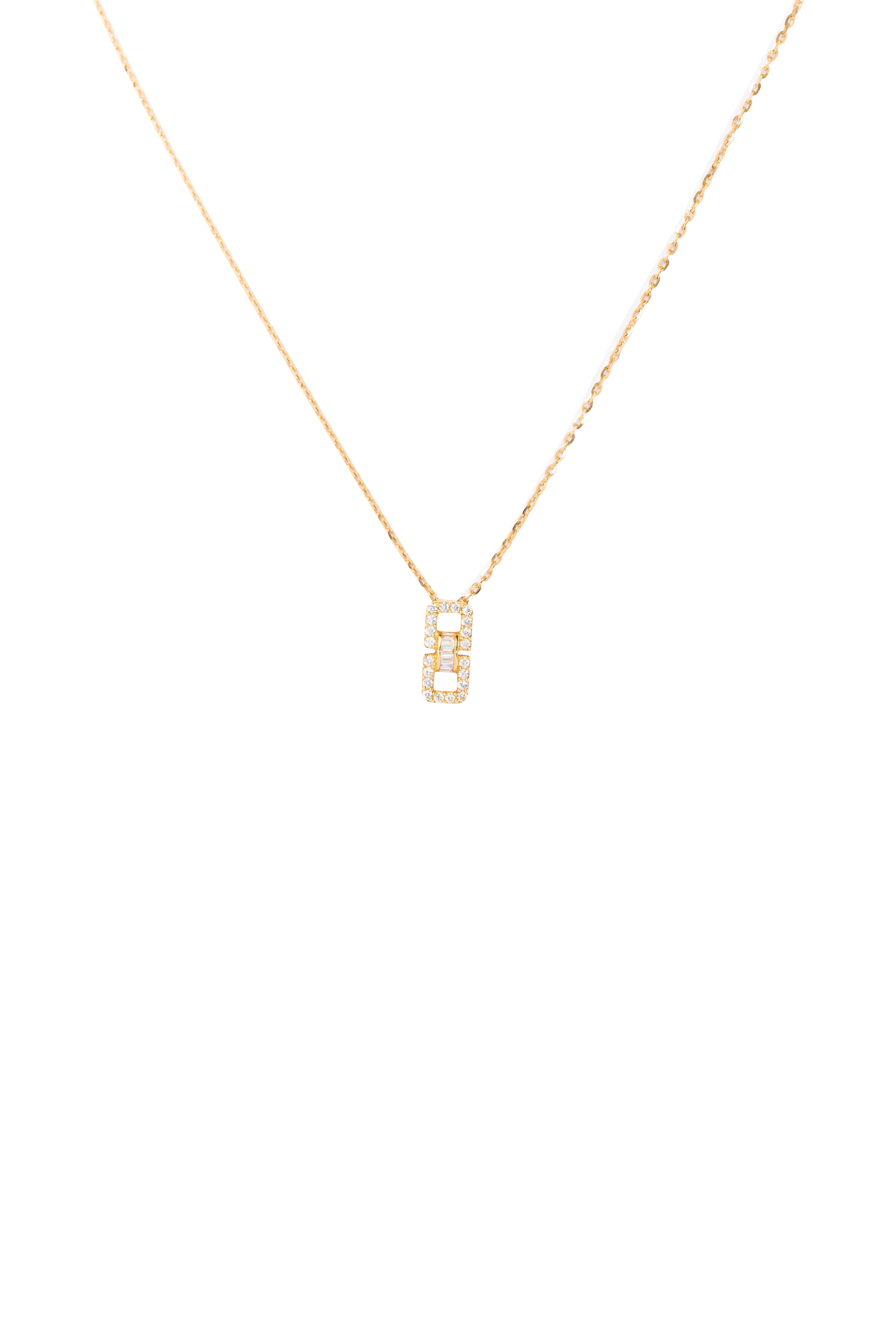 Gold necklace with a small rectangular pendant on a white background