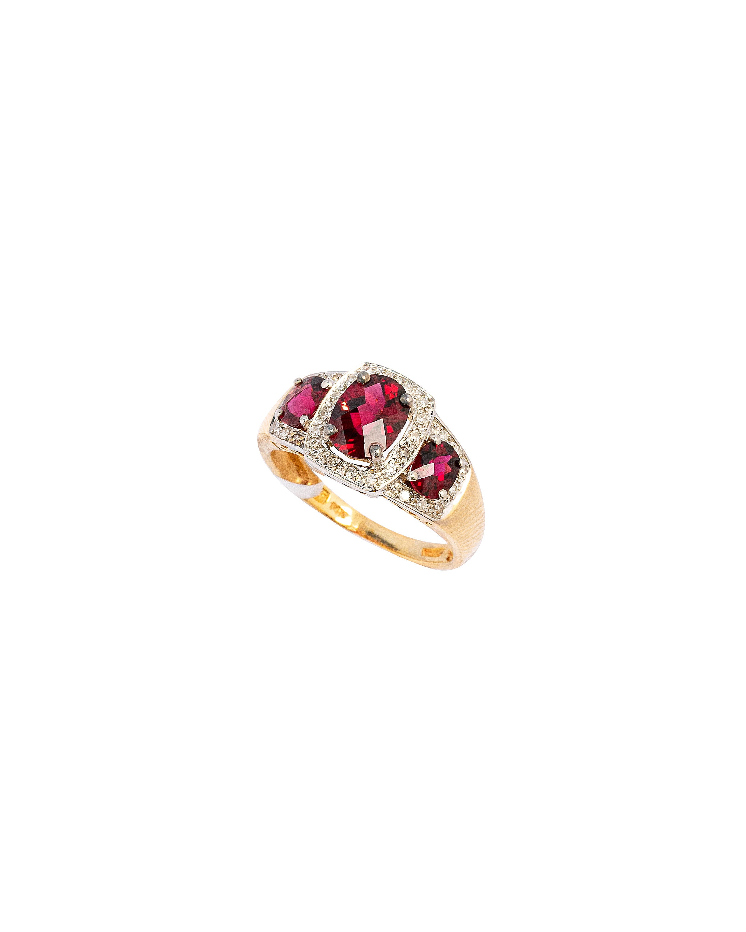 Gold ring with red gemstones on a white background