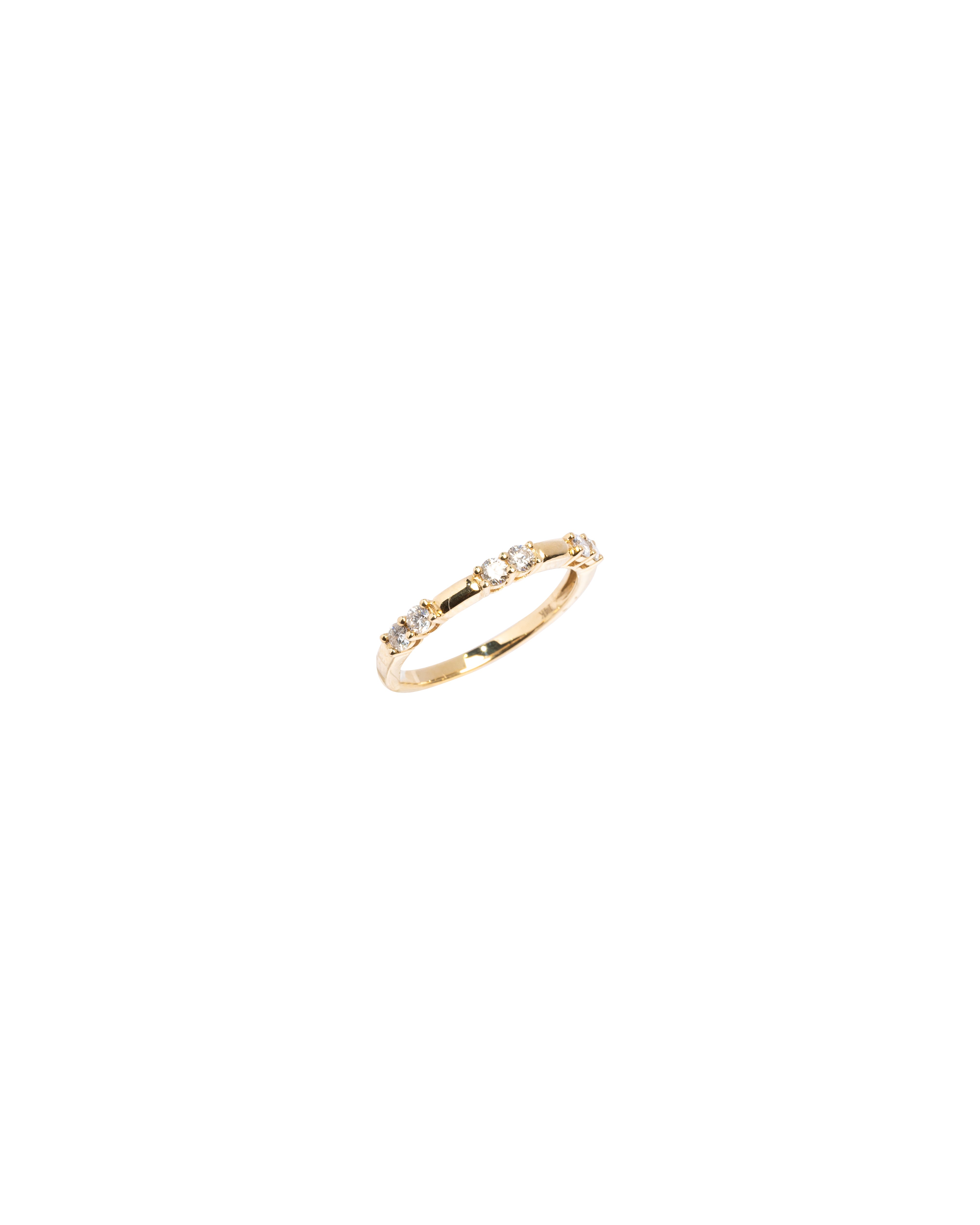 Gold ring with small stones on a white background