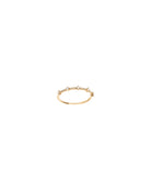 Gold ring with small stones on a white background