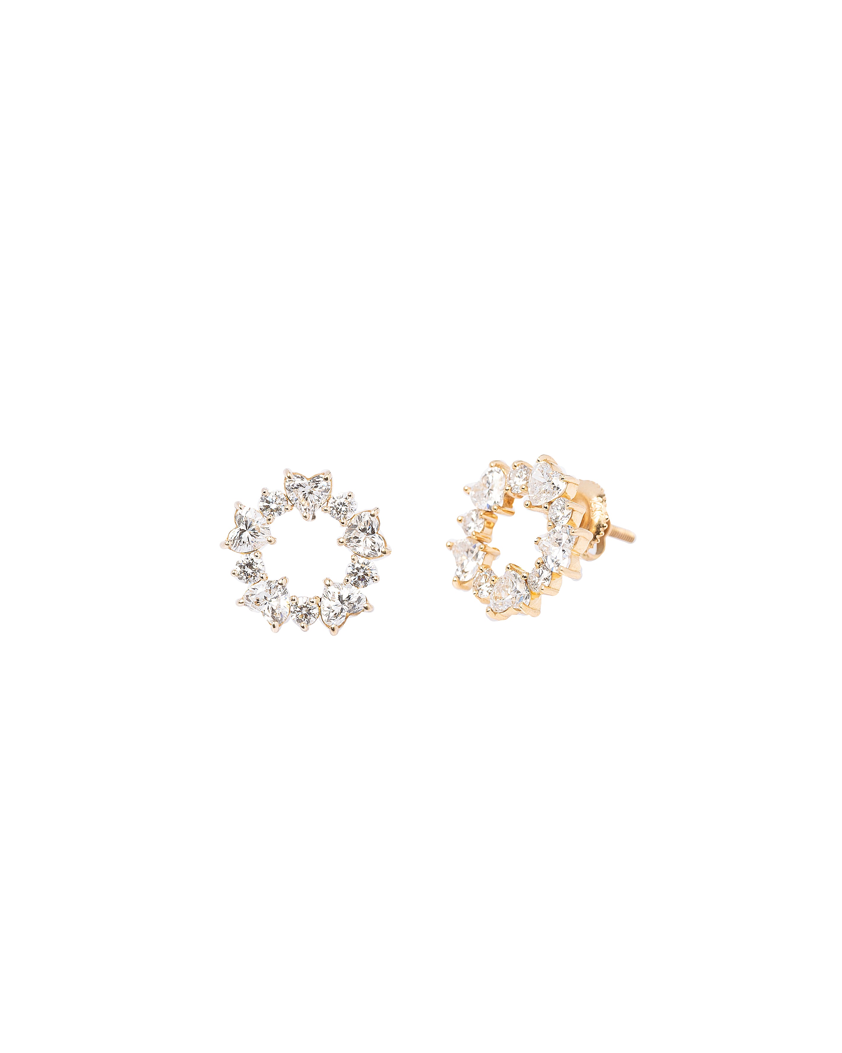 Two pairs of earrings, one gold and one silver, on a white background.
