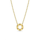 Gold necklace with a round pendant on a white background