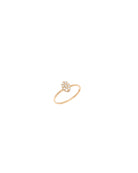 Gold ring with a small design on a white background
