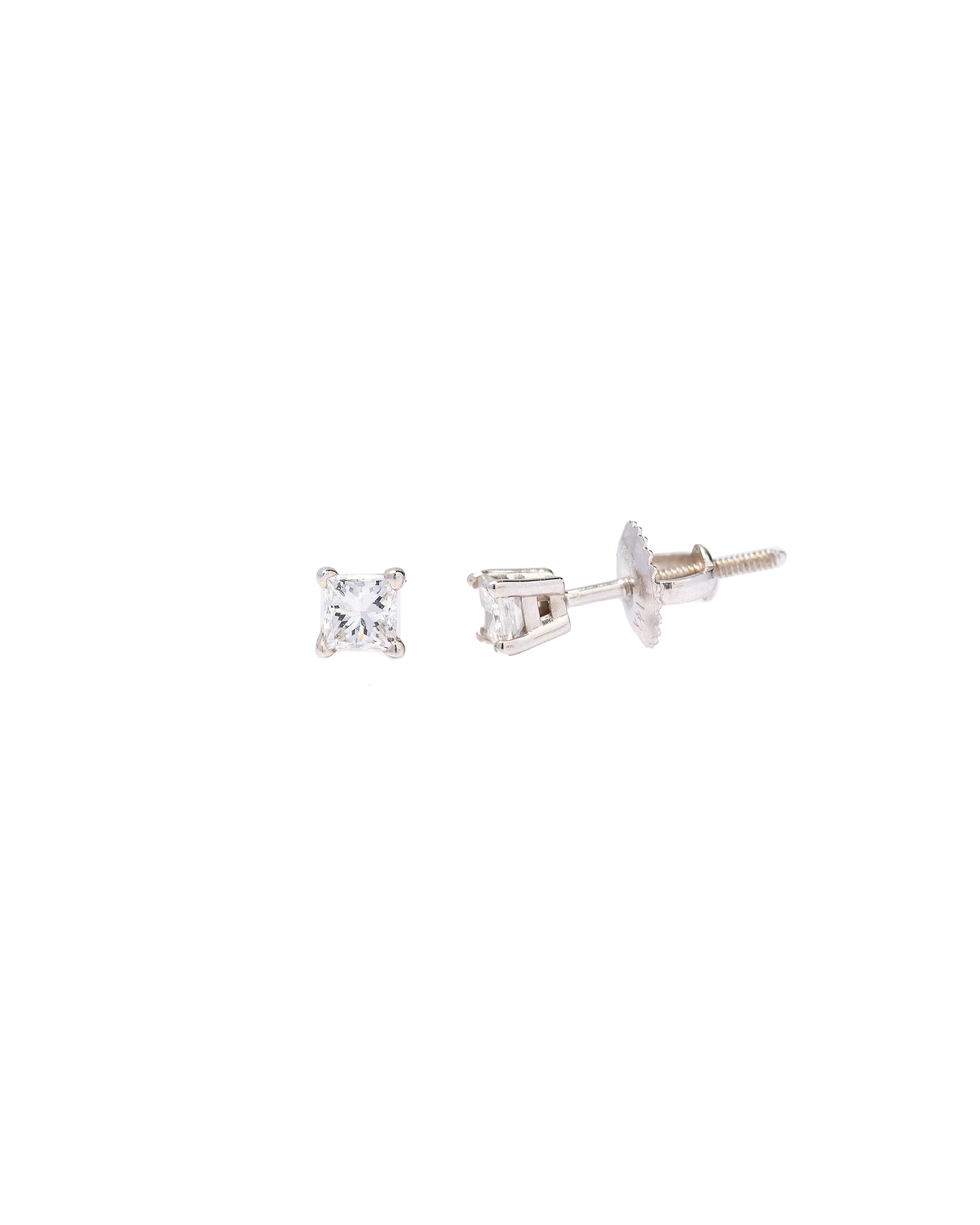 Pair of diamond stud earrings on a white background