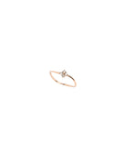 Rose gold ring with a small diamond on a white background