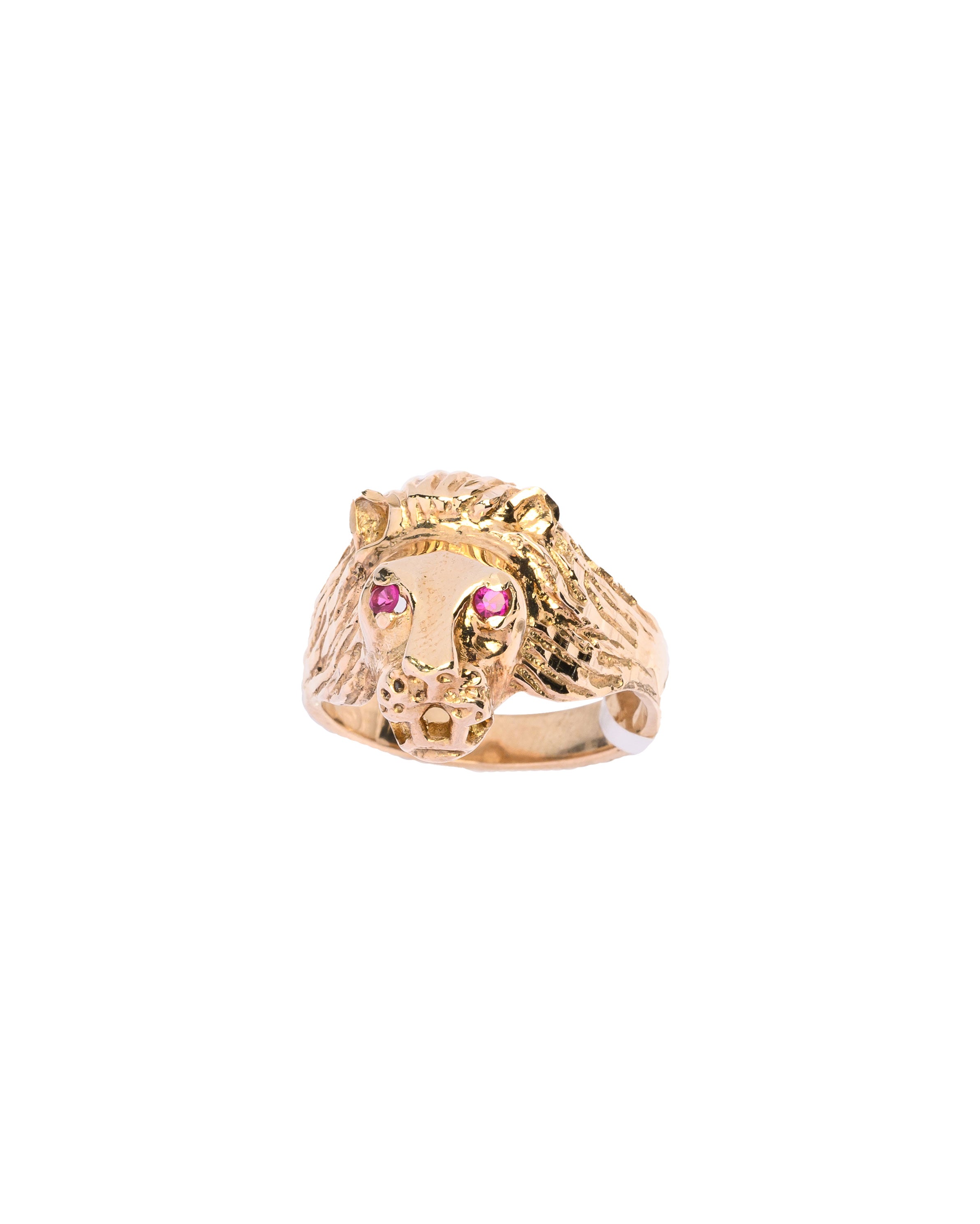 Gold lion head ring with pink gemstones on a white background