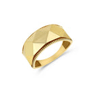 A 14K yellow gold ring with a geometric, faceted design and a band that tapers towards the back.