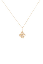 Gold necklace with a intricate pendant on a white background