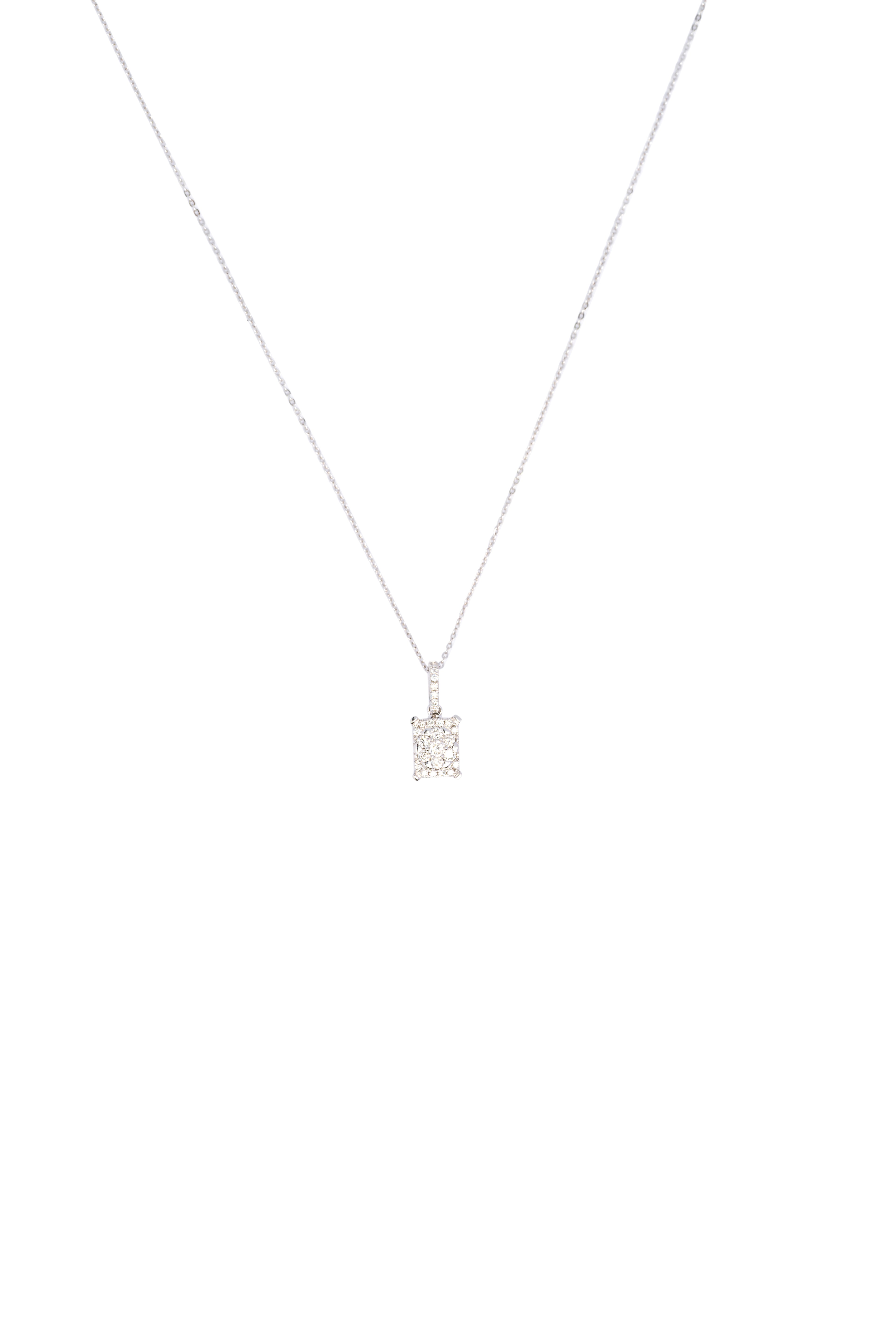 Silver necklace with a square pendant on a white background