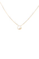 Gold necklace with a small round pendant on a white background