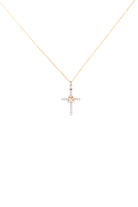 Gold necklace with a cross pendant on a white background
