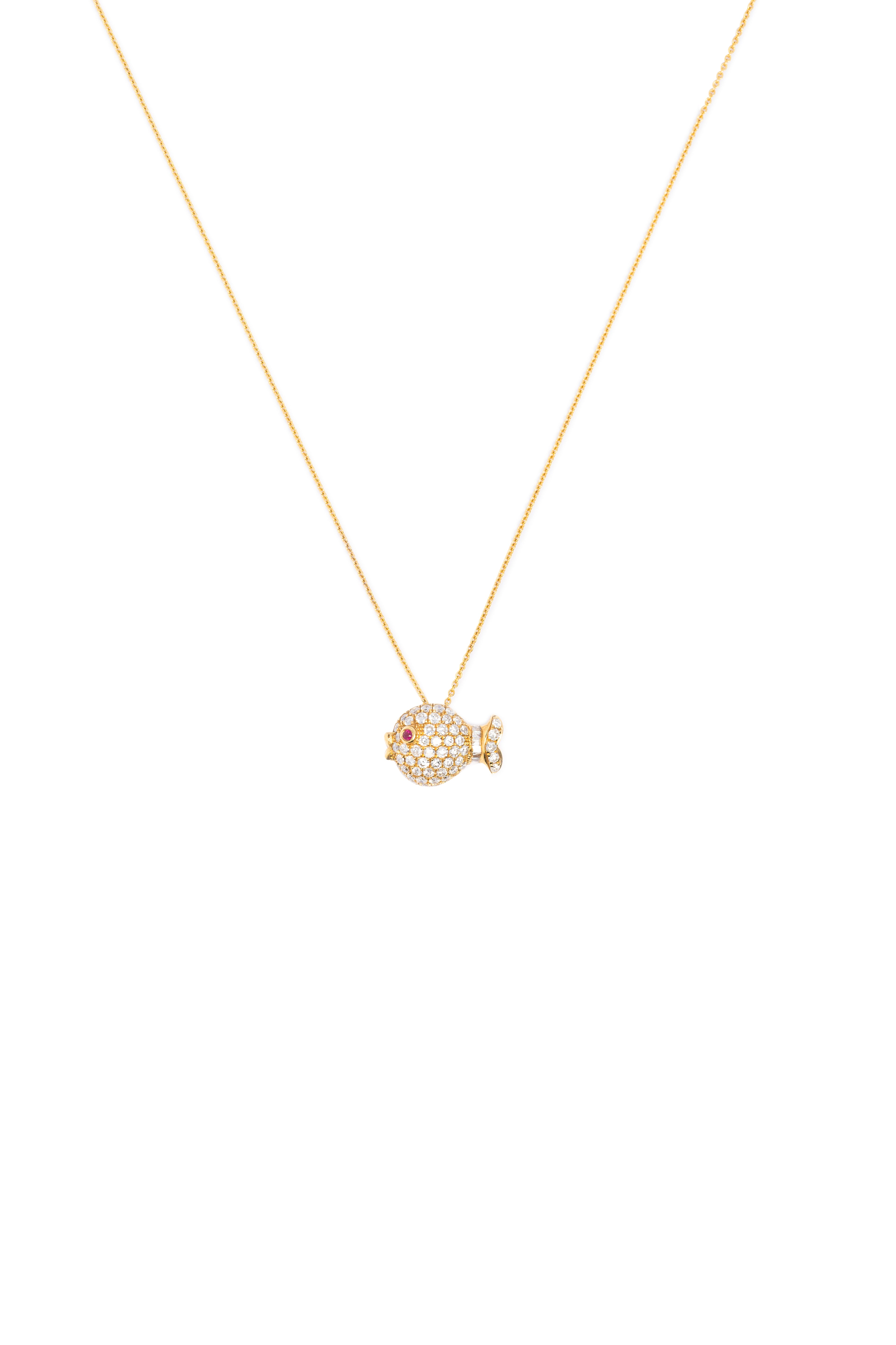 Gold necklace with a small, round, textured pendant on a white background