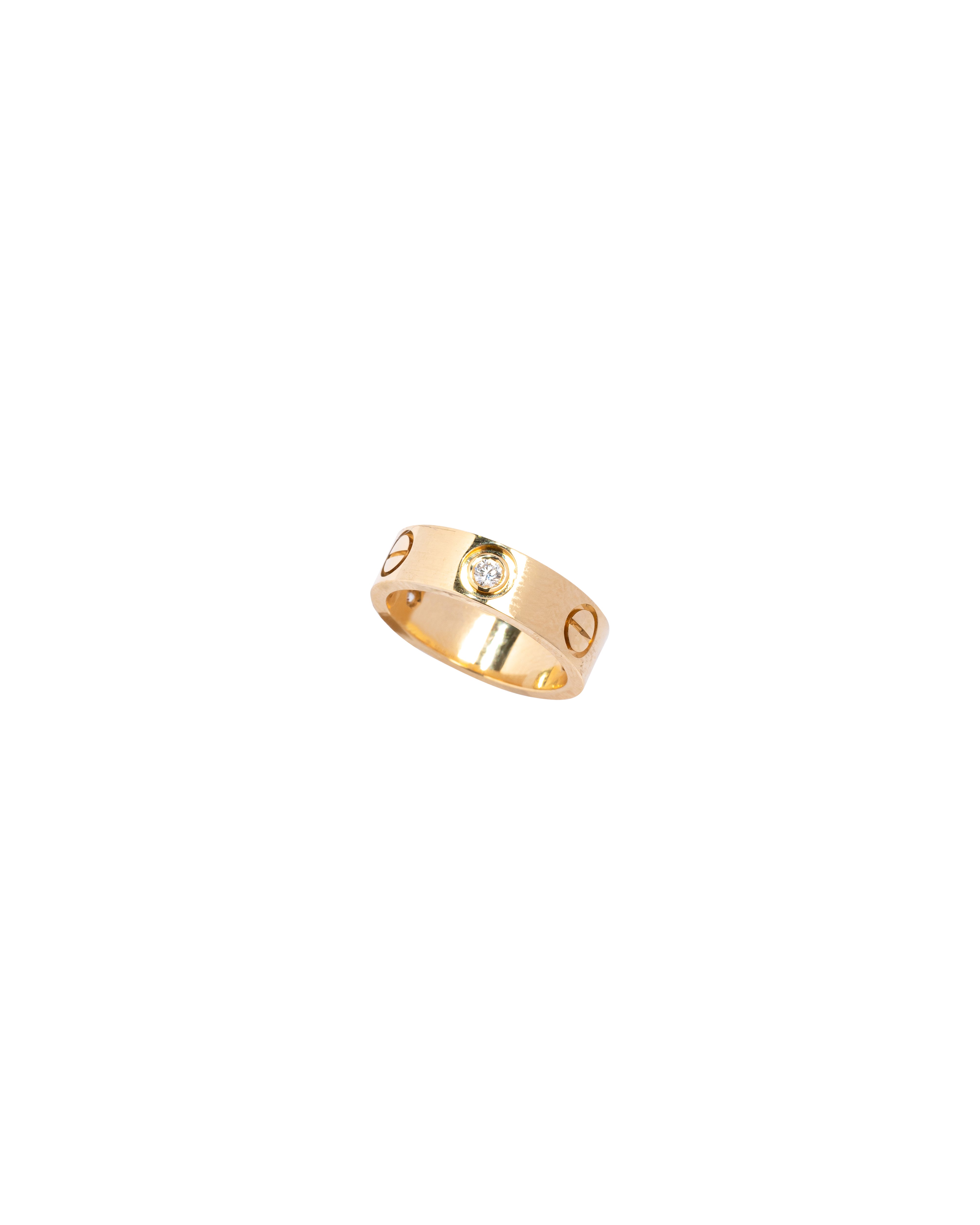 Gold ring with a diamond on a white background