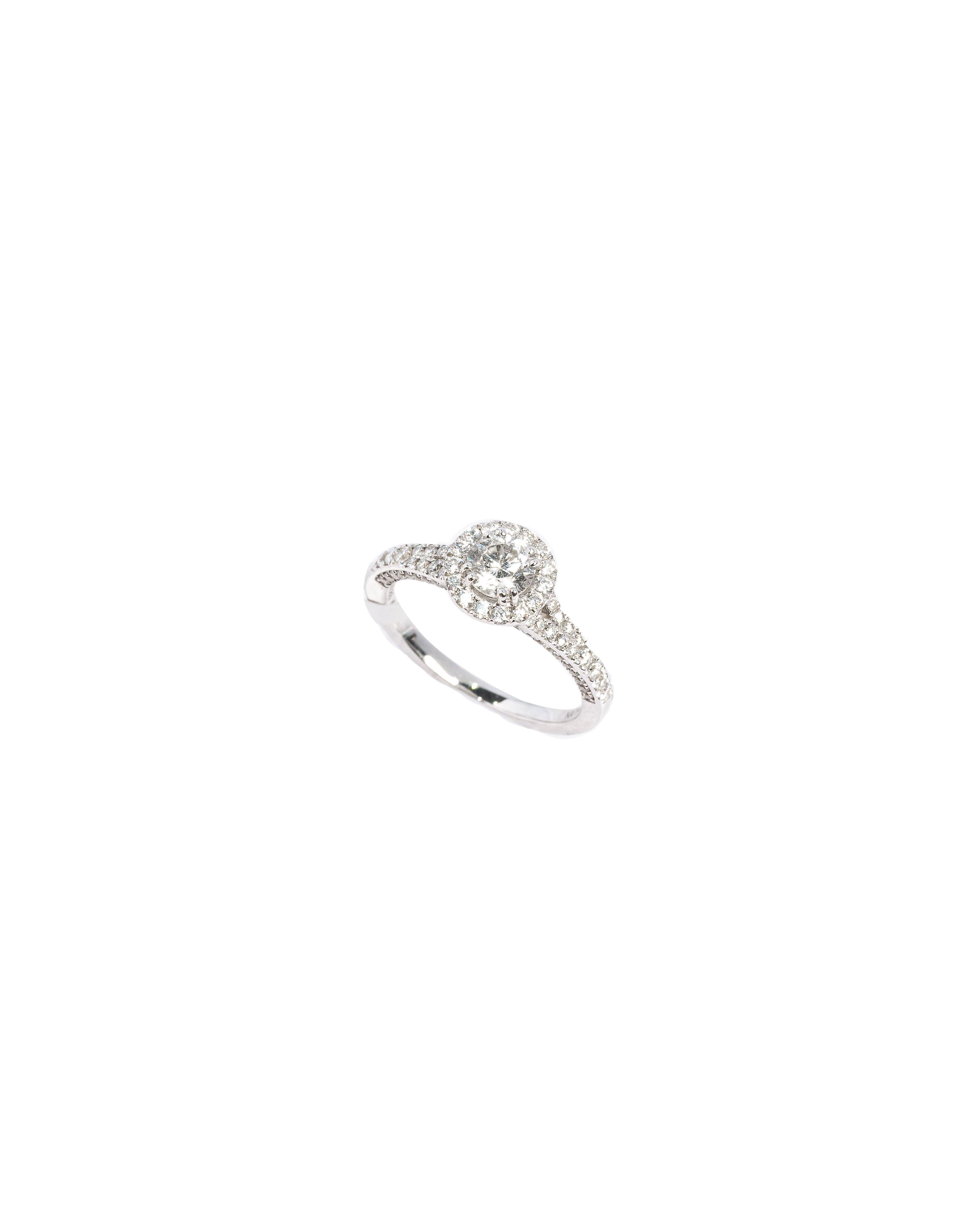 Silver ring with small diamonds on a white background