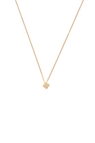 Gold necklace with a small pendant on a white background