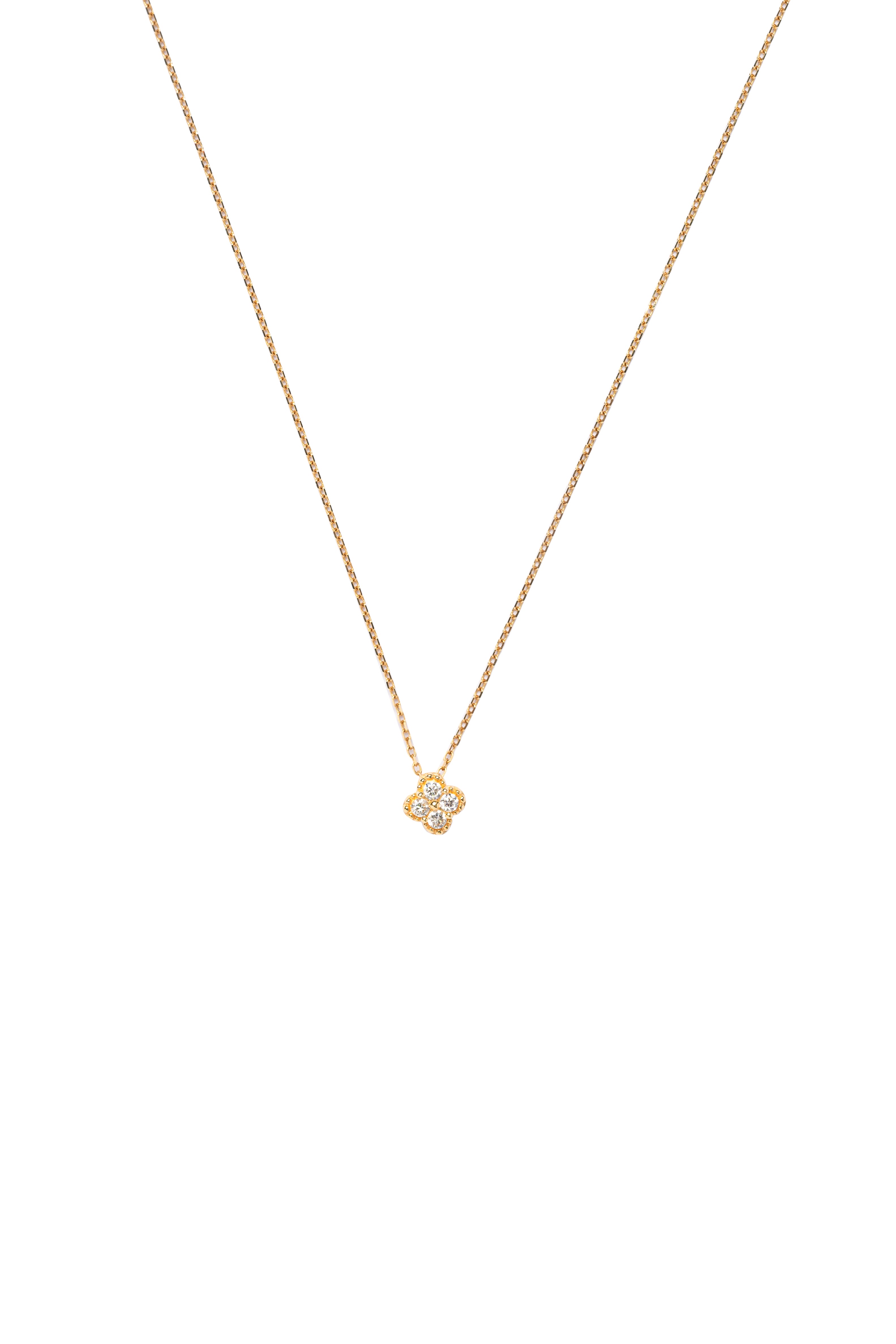 Gold necklace with a small pendant on a white background