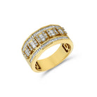 A yellow gold band ring with a row of baguette cut diamonds set in a prong setting.