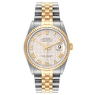 Two-tone watch with silver and gold band on a white background